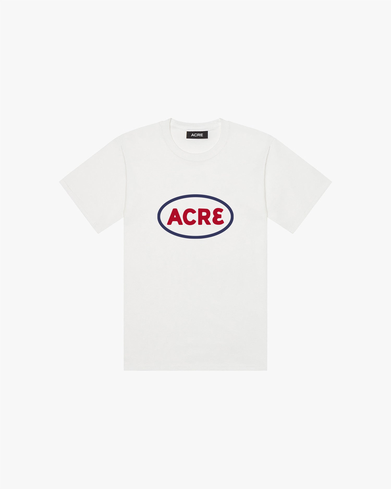 A white t-shirt with "Acre" printed on the chest in red around a blue oval.